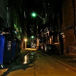 Unconscious body in back alley.