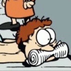 John Arbuckle (with a newspaper in his mouth)