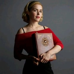 Sabrina Spellman (just finishing signing the book of the beast)